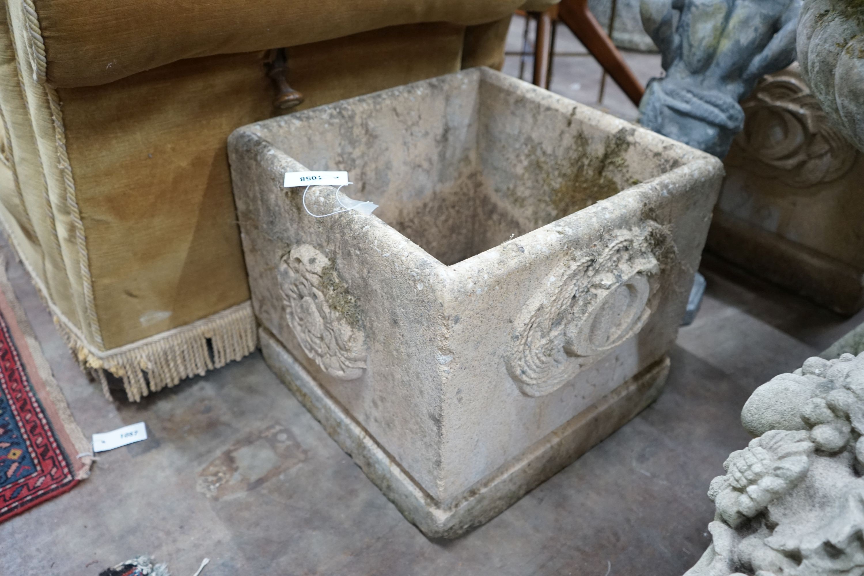 A pair of square reconstituted stone Fleurs de Lys garden planters, width 45cm, height 42cm